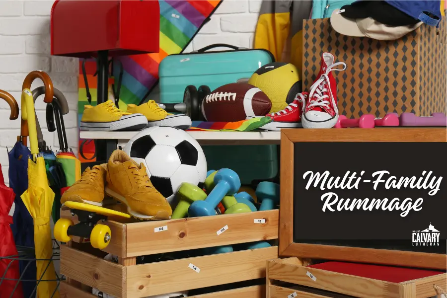 pile of garage sale stuff with a blackboard reading "multi-family rummage"